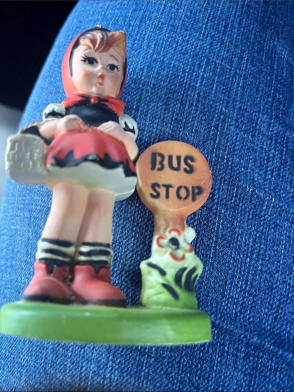 Hummel style plastic Christmas ornament - girl in red hood with bus stop sign